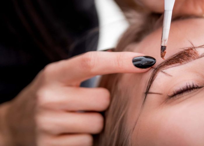 Permanent make up on eyebrows at beauty salon