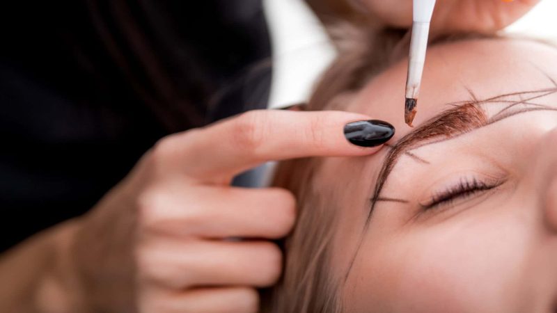 Permanent make up on eyebrows at beauty salon